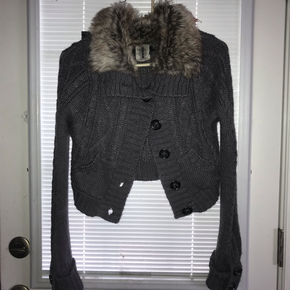 Sweater with faux fur collar.